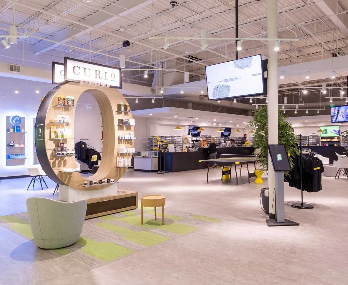 Modern cannabis dispensary interior with Curio circular display and lounge area